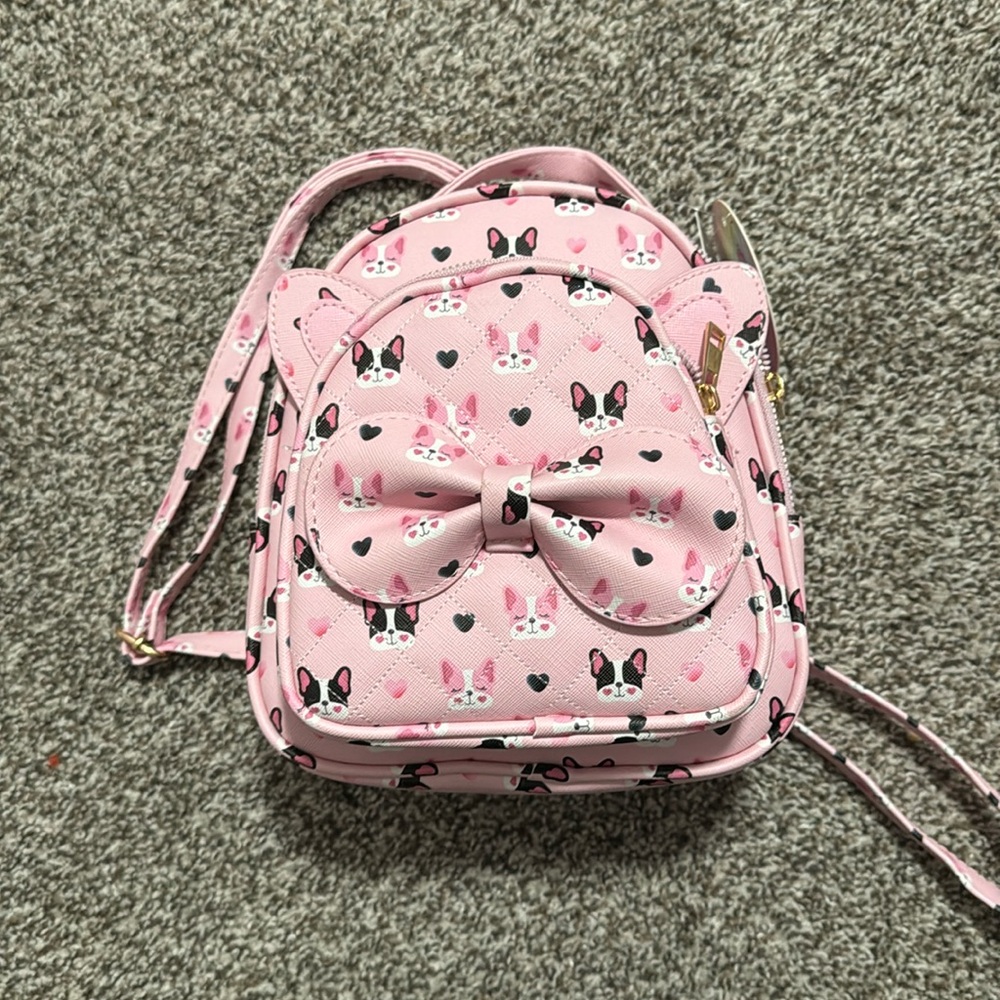 Cute pink mini dog backpack has french bulldog or frenchie